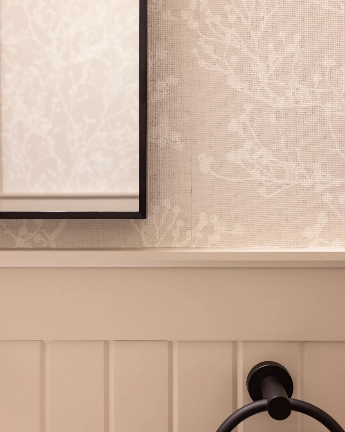 Detail of floral wallpaper above a quartz counter
